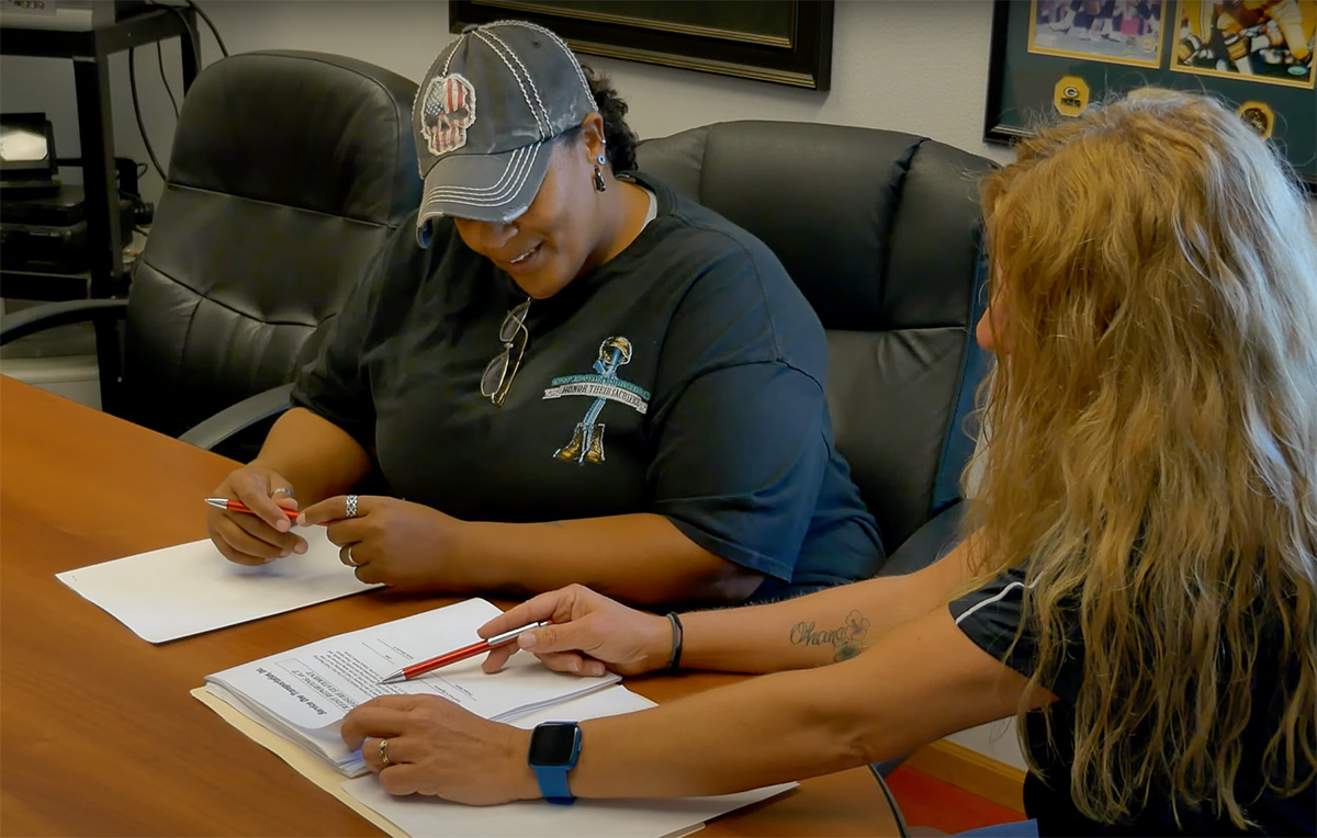 truck driver filling paper work to join Service One in Milwaukee office